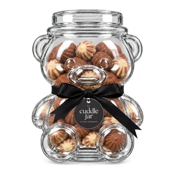 A glass teddy bear jar filled with Belgian chocolate